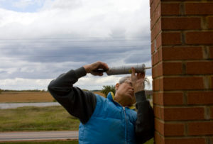 man repairing chimney brick