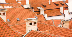 Chimney Crowns - Dallas TX - Hale's Chimney and Fireplace Solutions roof tops with orange tile and chimney crowns