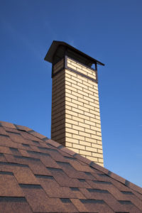 white chimney against blue sky