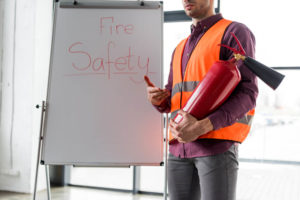 man teaching fire safety