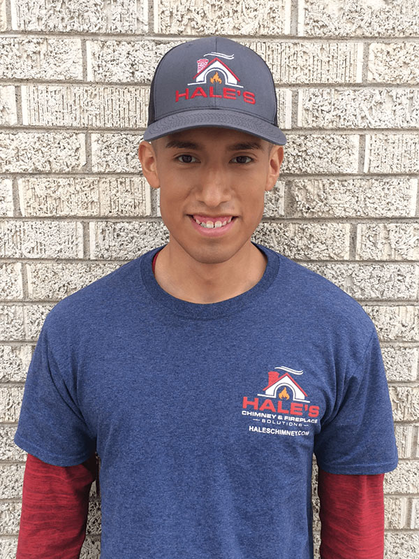 Original photo- Moises Arellano - Hale's Chimney Moises Arellano - Technician - hat and shirt with Hale's logo red long sleeve shirt underneath